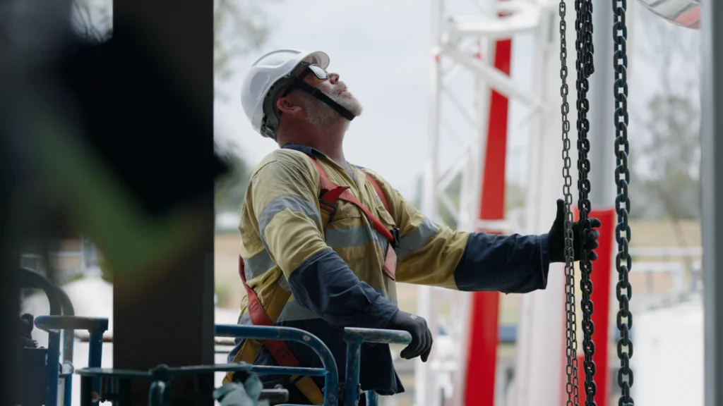 Crew member rigging by Precision Rigging & Logistics